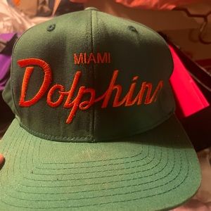 VINTAGE MIAMI DOLPHINS SNAPBACK. GREEN HAT ORANGE TRIM/writing. MITCHELL & NESS